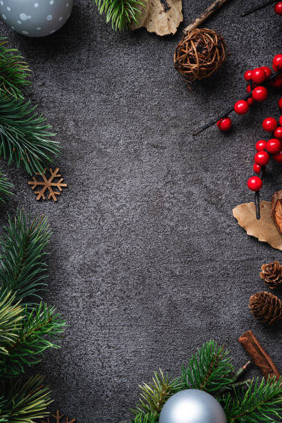 istock Christmas background design concept with fir tree branch border frame. 1357064720