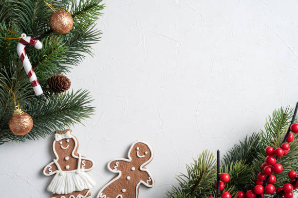 istock Decorated Christmas gingerbread cookies with decorations on white table background. 1357064735