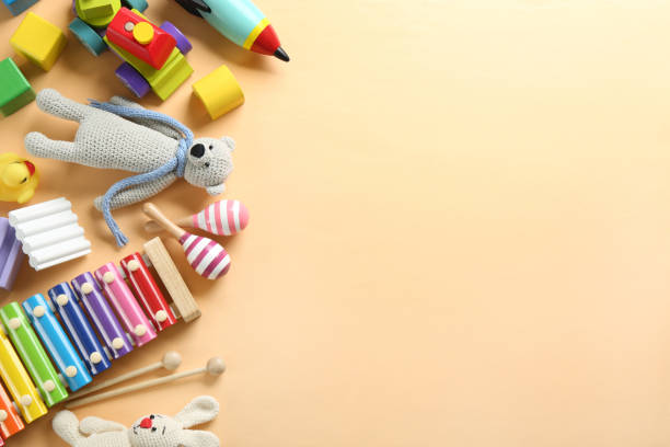 istock Different toys on beige background, flat lay. Space for text 1357070606