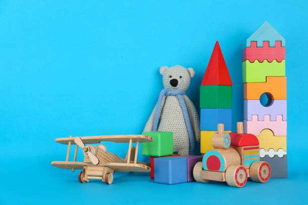 istock Set of different toys on blue background. Space for text 1357070620