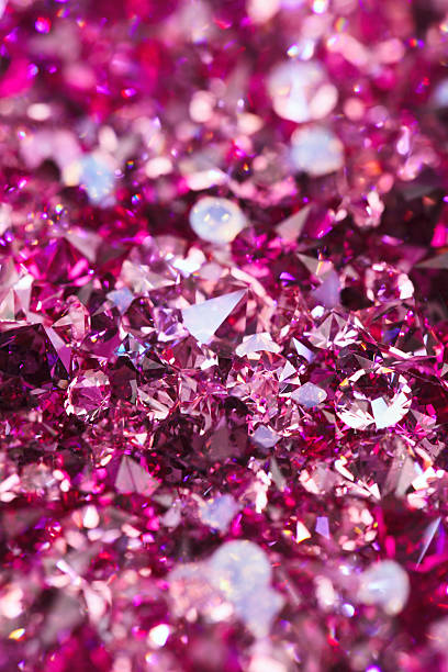 istock Close-up of hundreds of small shiny ruby diamond stones 135707079