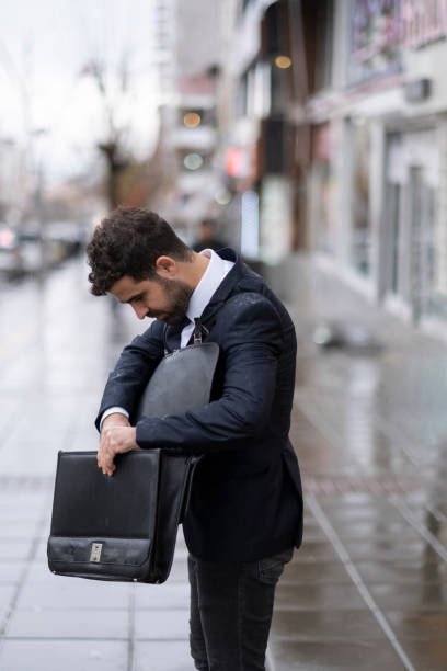 istock Happy Businessman In The Rain 1357079494