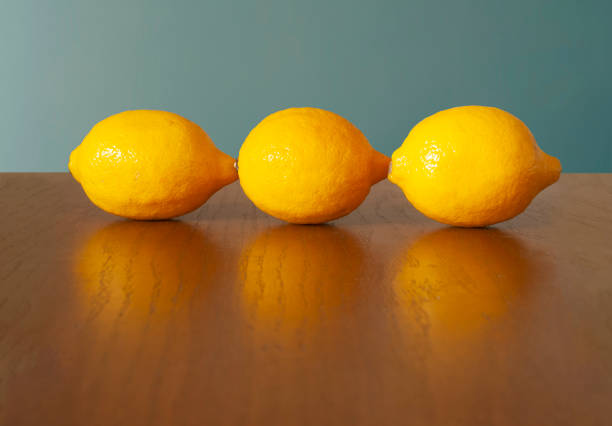 Ripe fresh lemons in wooden basket
