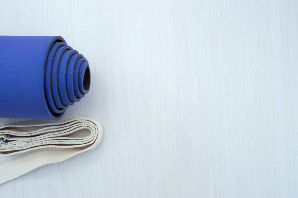 istock Yoga Mat and yoga belt on a light background 1357080292
