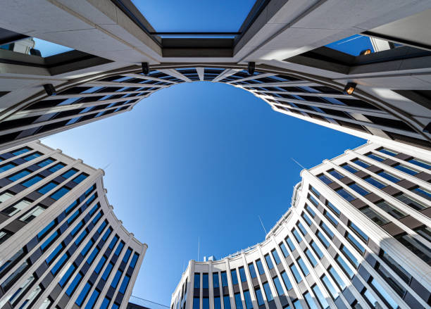 istock Low Angle View Of Modern Buildings Against Clear Blue Sky 1357083940