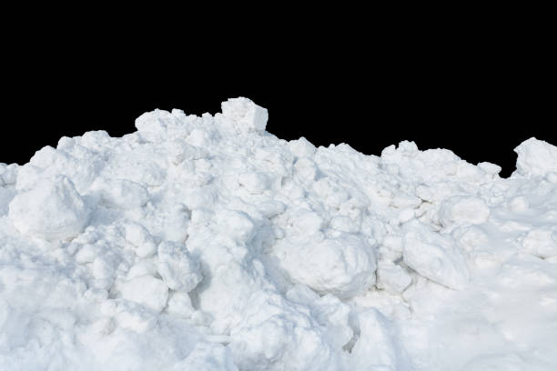 istock Lumps of snow on a black isolated background. 1357085982