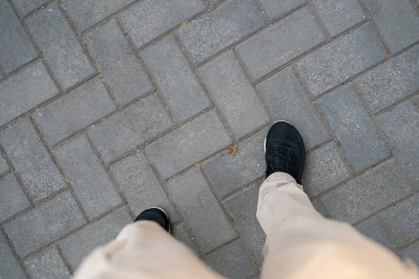 Men Walking on the Floor Tiles
