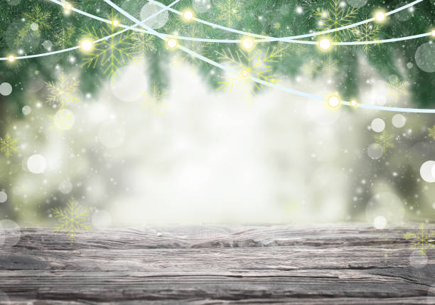 istock Blue winter background with green fir twigs, blurred lights and highlights. 1357090773