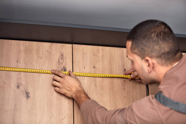istock Handyman making kitchen wall cabinets in the apartment. 1357091482