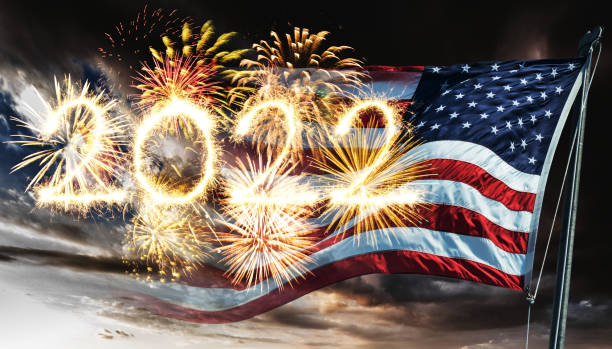 istock fireworks against the us flag 1357092729