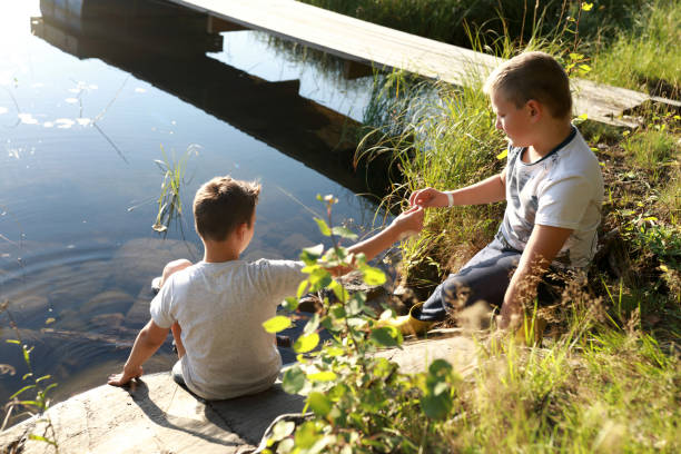 istock Children playing by lake 1357094105