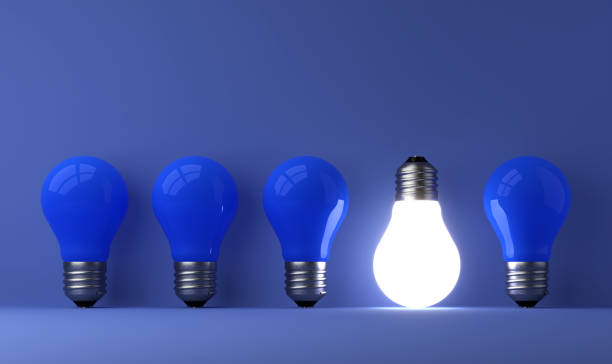 istock old classic light bulb in front of background 1357094152