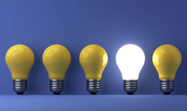 istock old classic light bulb in front of background 1357094856