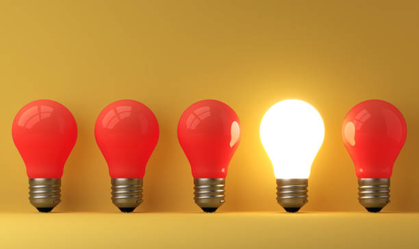 istock old classic light bulb in front of background 1357094945