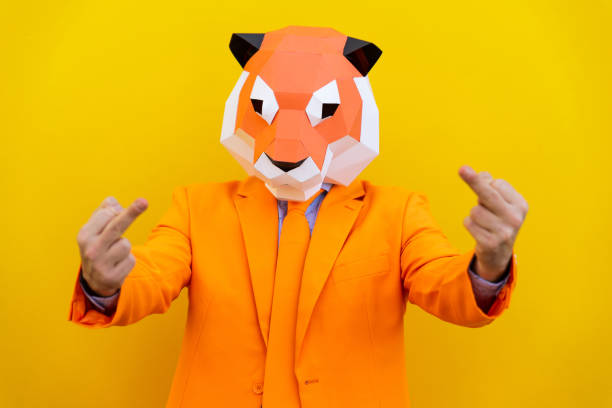 istock Cool man wearing 3d origami mask 1357096295