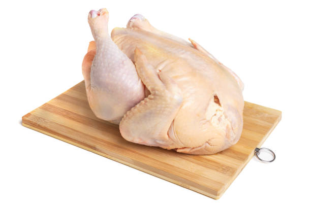 istock A whole chicken carcass on a cutting board, isolate on a white background. Natural farm chicken 1357096319