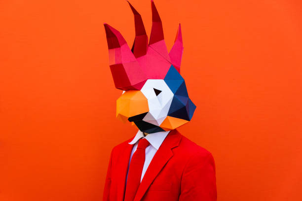 istock Cool man wearing 3d origami mask 1357096344