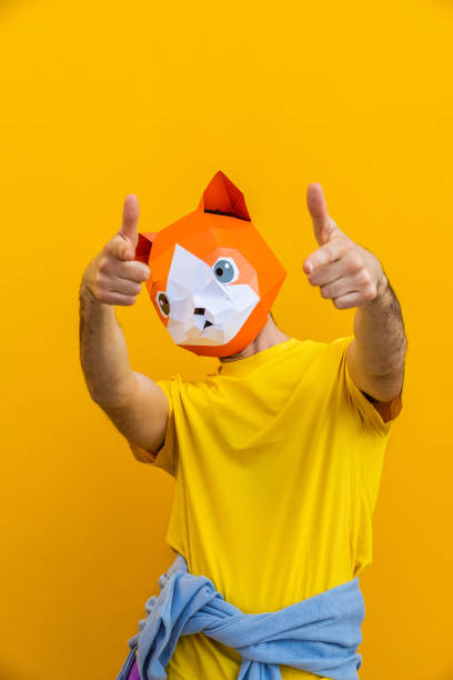 istock Cool man wearing 3d origami mask 1357096357