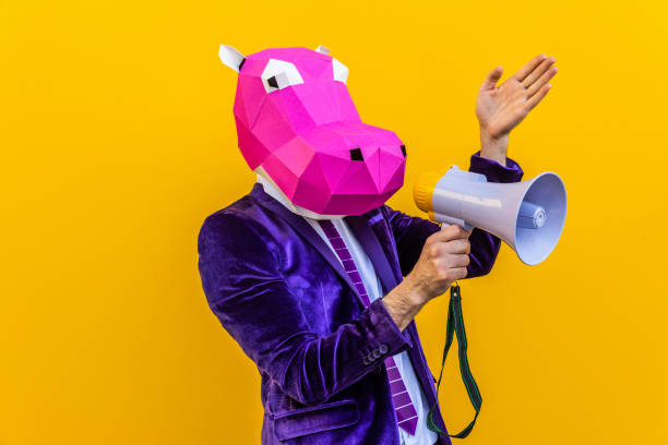 istock Cool man wearing 3d origami mask 1357096558