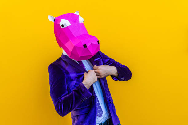 istock Cool man wearing 3d origami mask 1357096636
