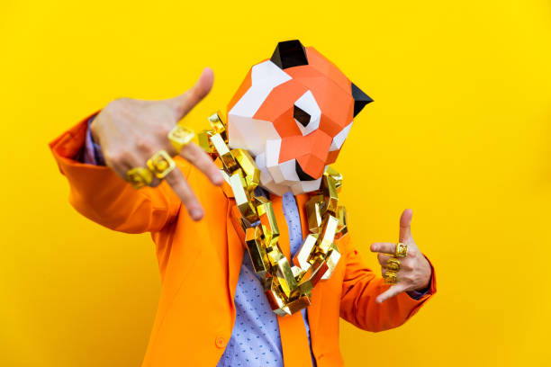 Cool man wearing 3d origami mask Cool man wearing 3d origami mask with stylish colored clothes - Creative concept for advertising, animal head mask doing funny things on colorful background comedian photos stock pictures, royalty-free photos & images