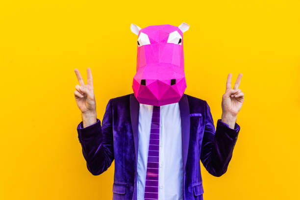 istock Cool man wearing 3d origami mask 1357097396