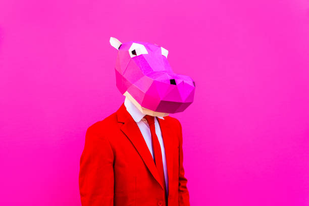 istock Cool man wearing 3d origami mask 1357097432