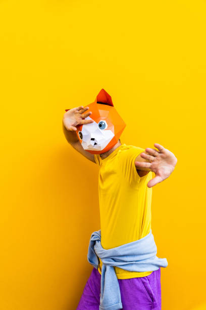 istock Cool man wearing 3d origami mask 1357097446