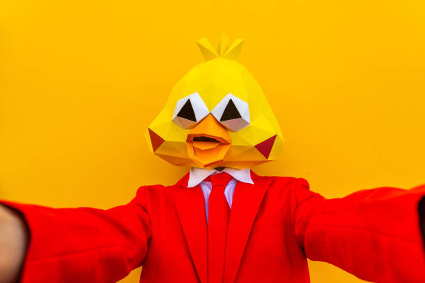 istock Cool man wearing 3d origami mask 1357097684