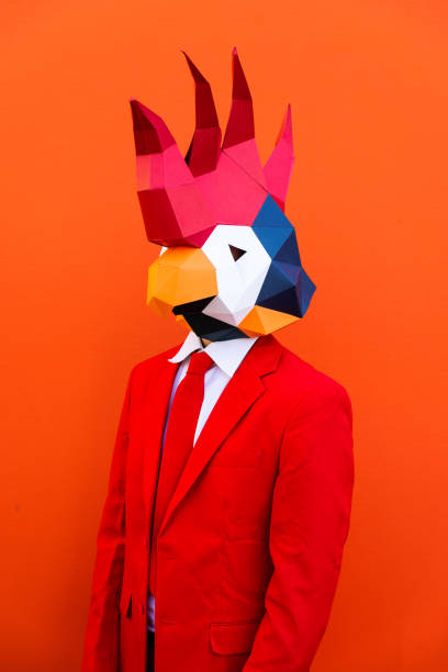 istock Cool man wearing 3d origami mask 1357097722