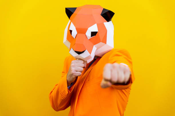 istock Cool man wearing 3d origami mask 1357097879