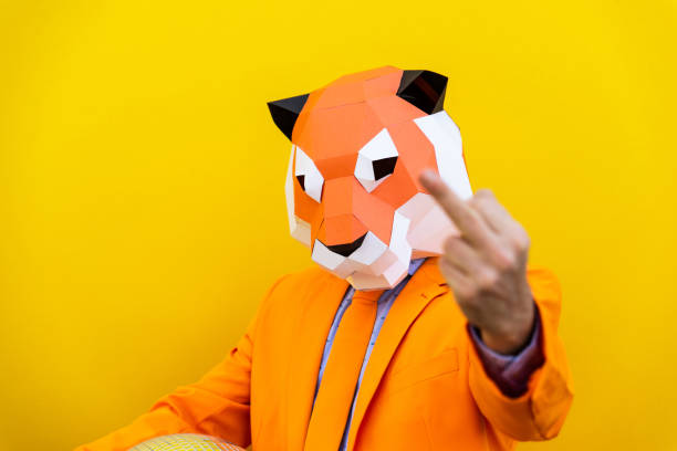 istock Cool man wearing 3d origami mask 1357097911