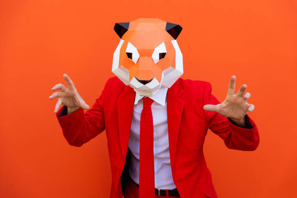 istock Cool man wearing 3d origami mask 1357098022
