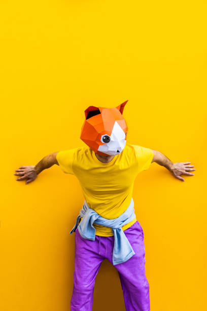 istock Cool man wearing 3d origami mask 1357098097