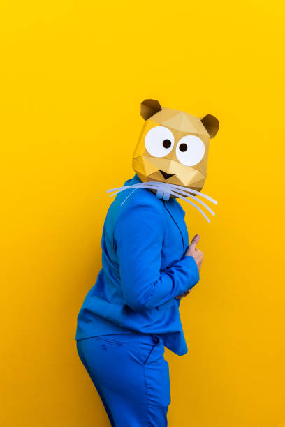 istock Cool man wearing 3d origami mask 1357098710