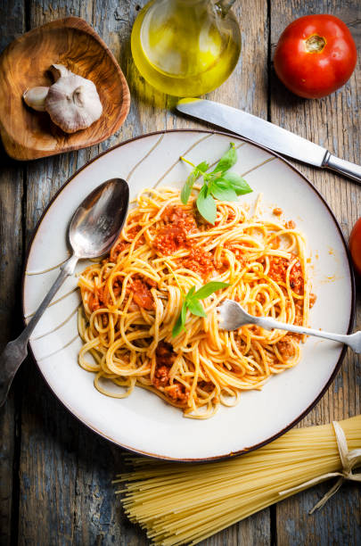 istock Italian spaghetti on rustic wooden table 1357098783