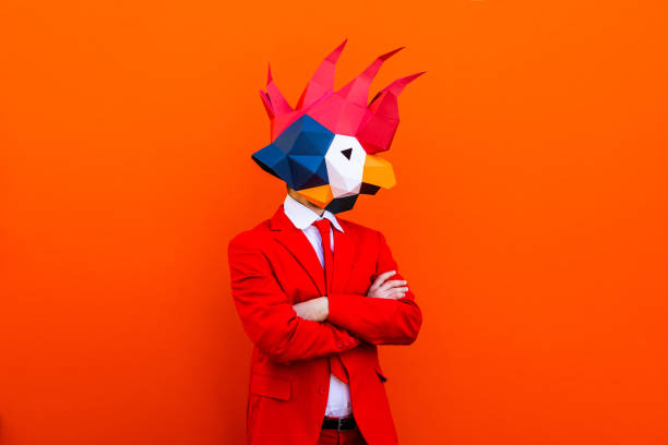 istock Cool man wearing 3d origami mask 1357099053