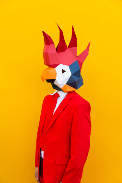 istock Cool man wearing 3d origami mask 1357099097