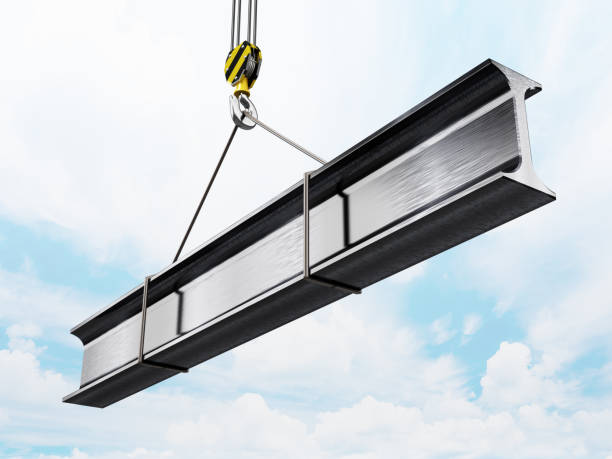 istock Industrial crane carrying iron rod against blue sky 1357099111