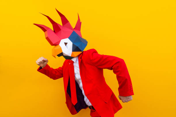istock Cool man wearing 3d origami mask 1357099117