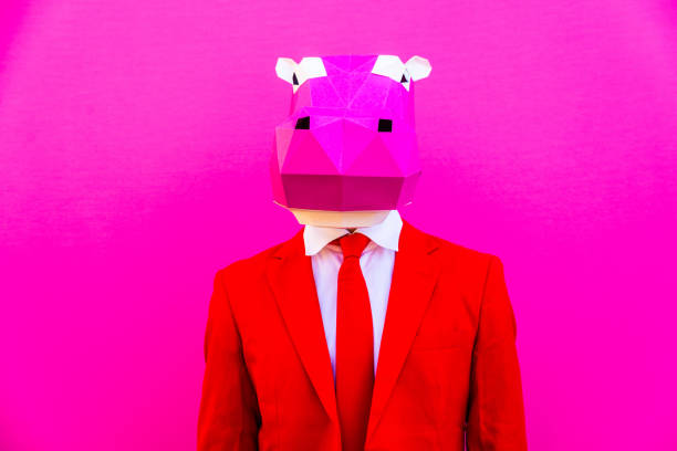 istock Cool man wearing 3d origami mask 1357099232