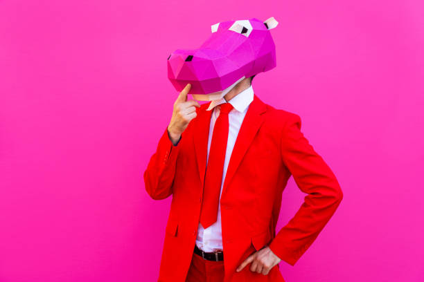 istock Cool man wearing 3d origami mask 1357099242