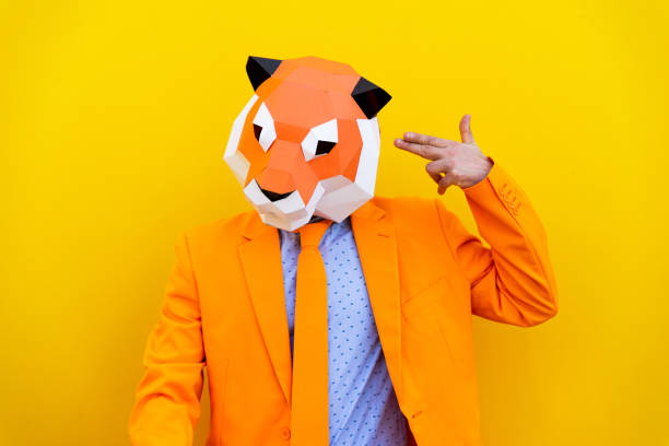 istock Cool man wearing 3d origami mask 1357099255