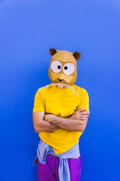 istock Cool man wearing 3d origami mask 1357099388