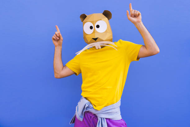 istock Cool man wearing 3d origami mask 1357100037