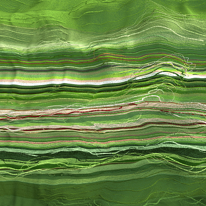 Green threads lines flowing and on gray background, CGI and photography combined.