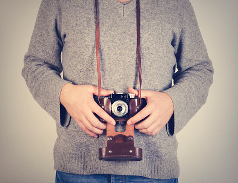 Man holding retro camera