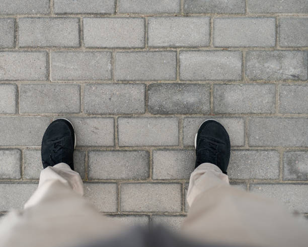 istock Men Standing on the Floor Tiles 1357102842