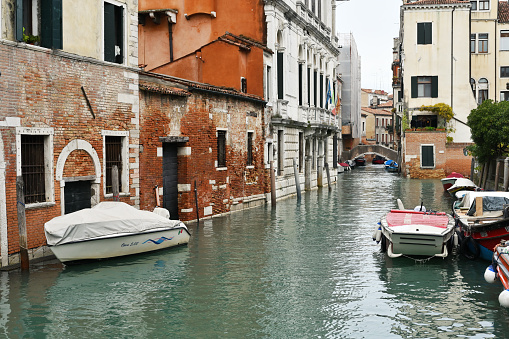 Venice, Italy - November 03, 2021: Old Town architecture and view to small canal in Venice, Italy