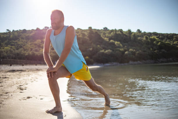 istock Morning exercise on the beach by the sea 1357106637